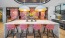a kitchen island with a table and chairs
