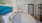 a bedroom with a bed and a bathroom entrance