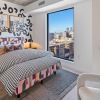 Bedroom with natural lighting and high ceilings